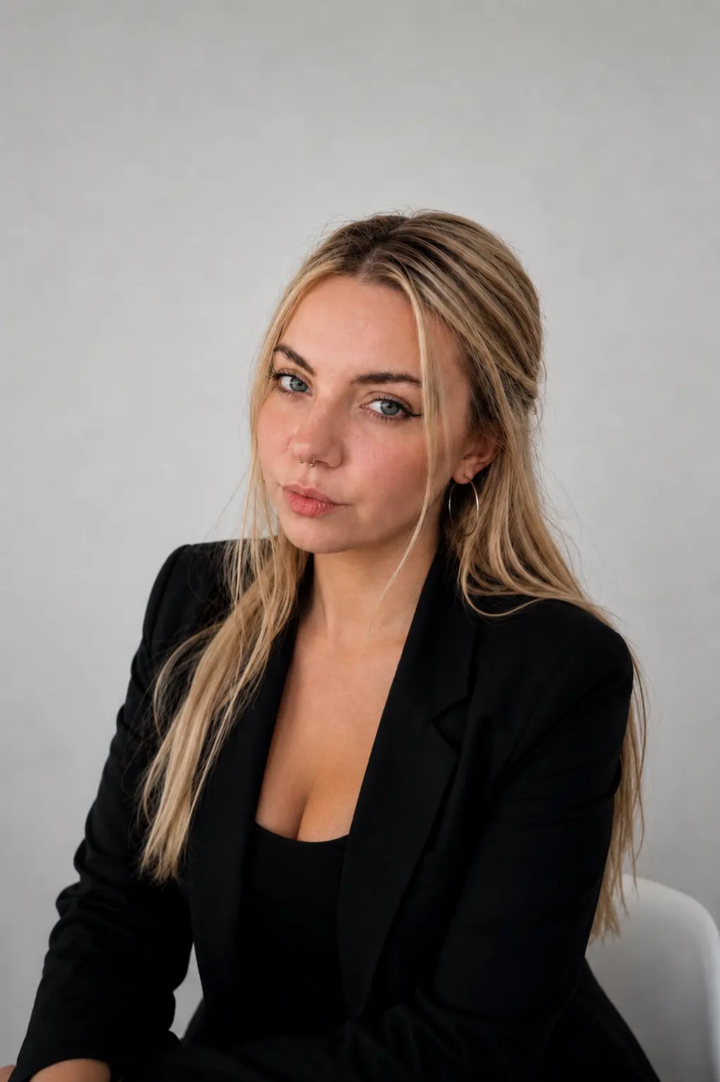 Veronika tilting her head, studio backdrop